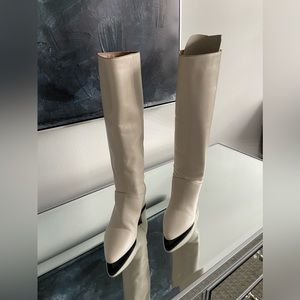 Off white boots worn once indoors.